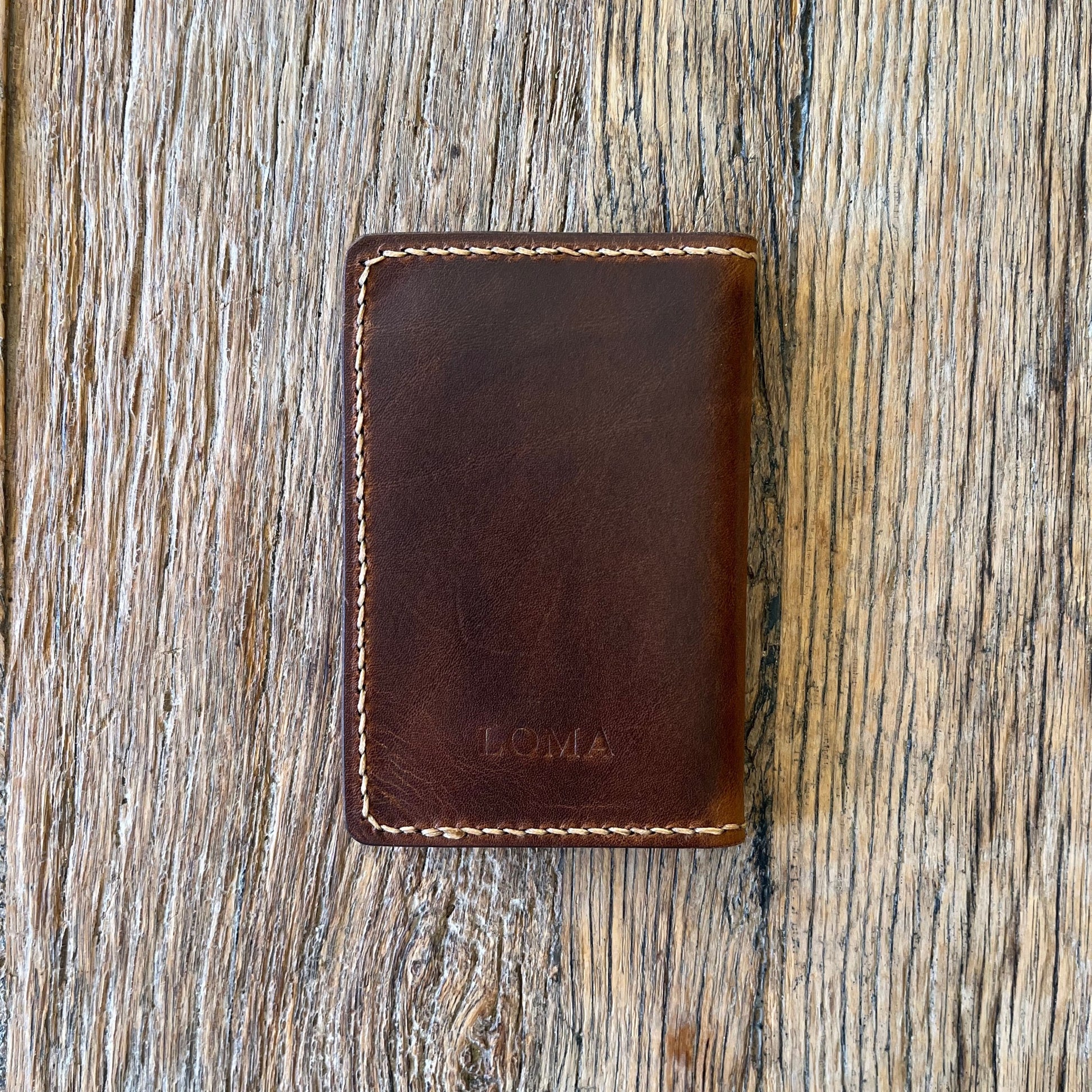Back view of a brown italian leather bi-folding wallet