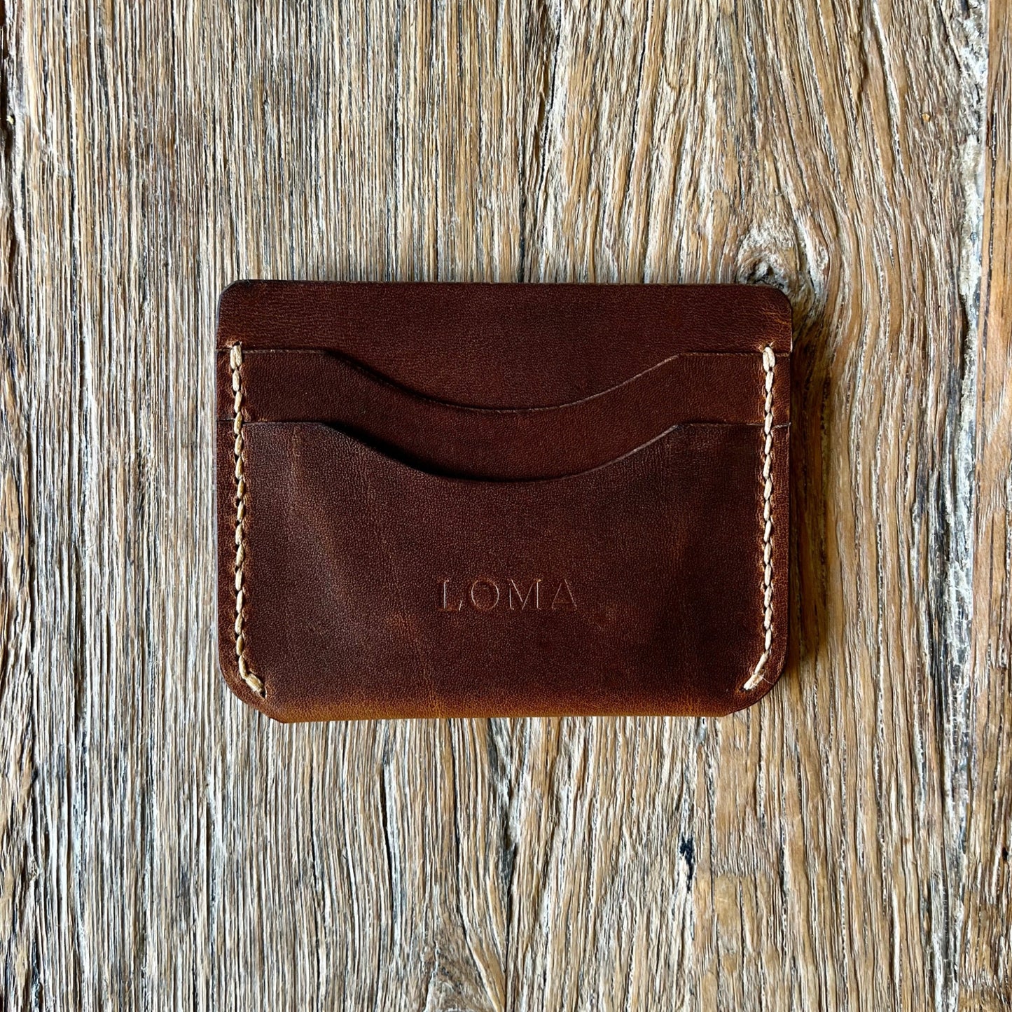 A five slot Italian leather card holder in brown back view