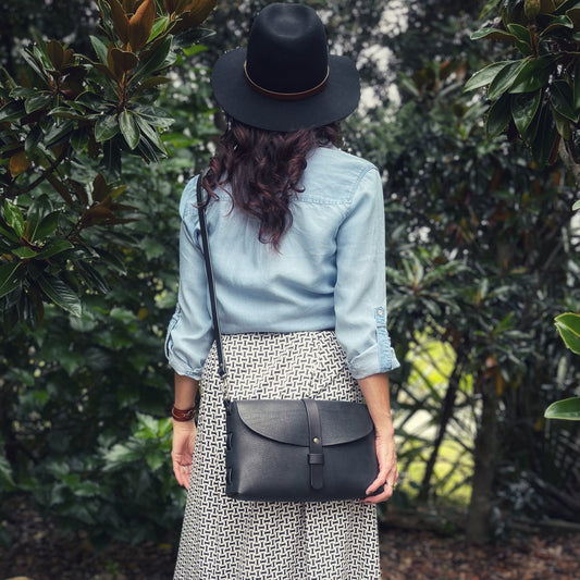 Milled black large crossbody bag on a model