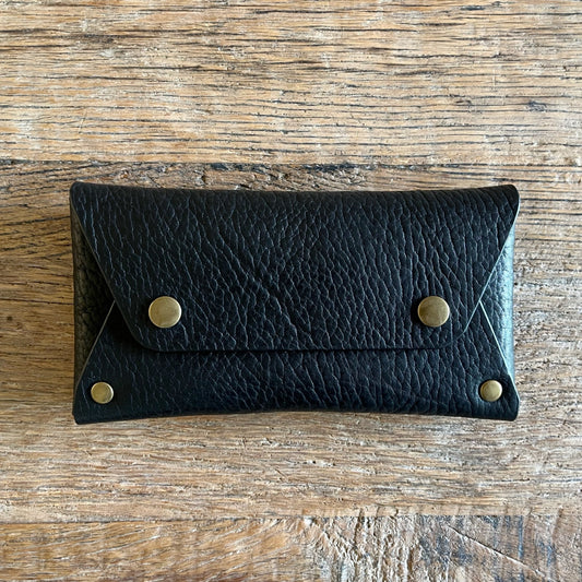 Stevie black wallet with brass snap closure front view